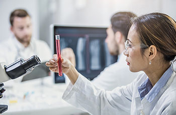 BIDMC Hematologist holding a test tube BIDMC Hematologist holding a test tube
